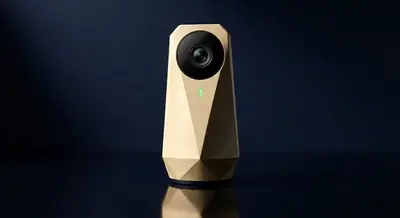 Haven Vigil camera — faceted brushed-gold unit with wide-angle black lens